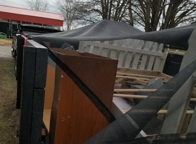 commercial furrnitures on a dumpster